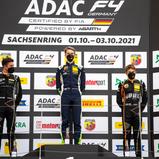 Sieger Lomko (M.) auf dem Podium neben Bearman (l.) und Bedrin