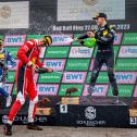 Die Sektdusche auf dem Podium mit René Rast, Sheldon van der Linde und Thomas Preining (l-r)